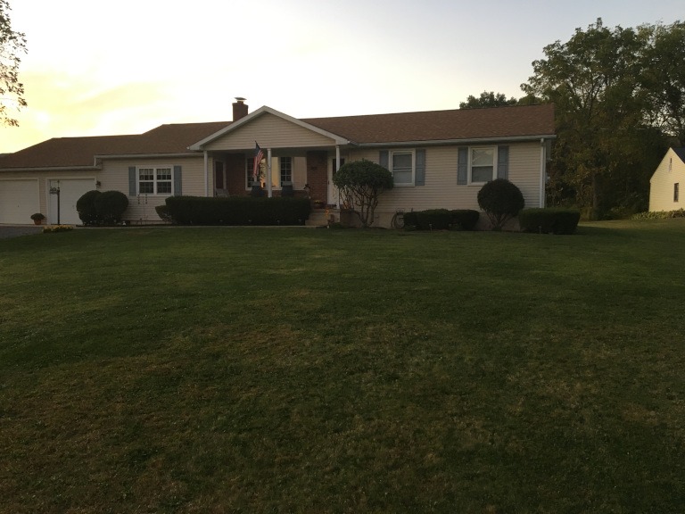 A photo of an unlandscaped lawn used as a base for a 3D model