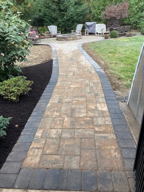Paving stones leading to a fire pit