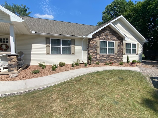 Freshly planted shrubs and flowers in the front yard