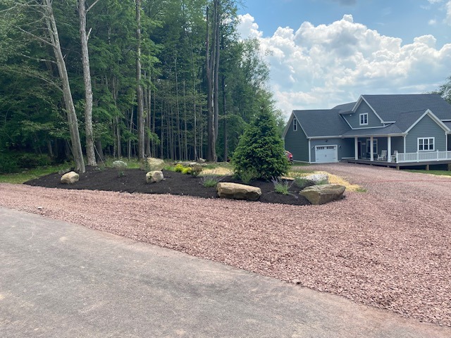 A new landscaping installation next to the driveway