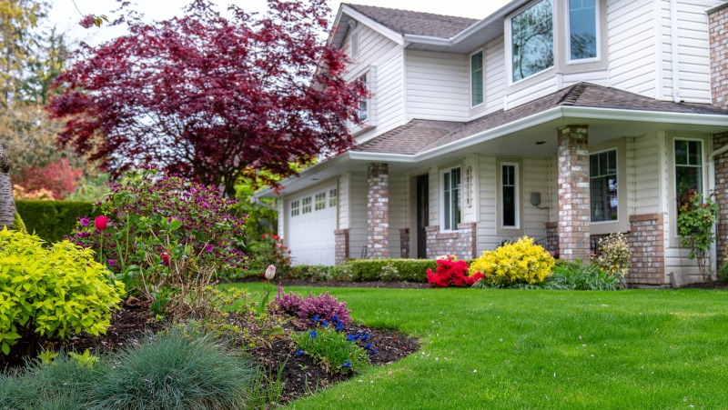 A well-landscaped garden in front of a house